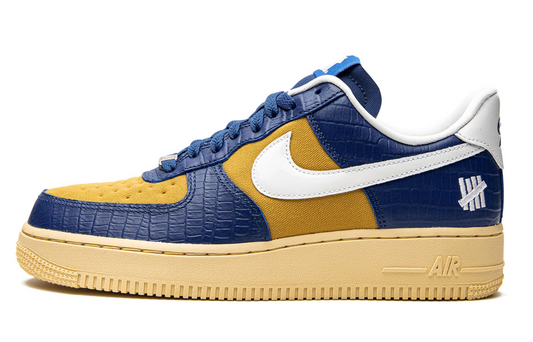 Nike Air Force 1 undefeated on it blue yellow croc